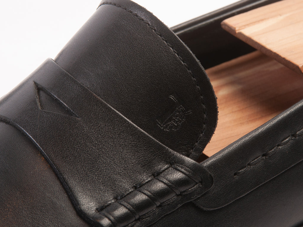 Tod’s Black Penny Loafers